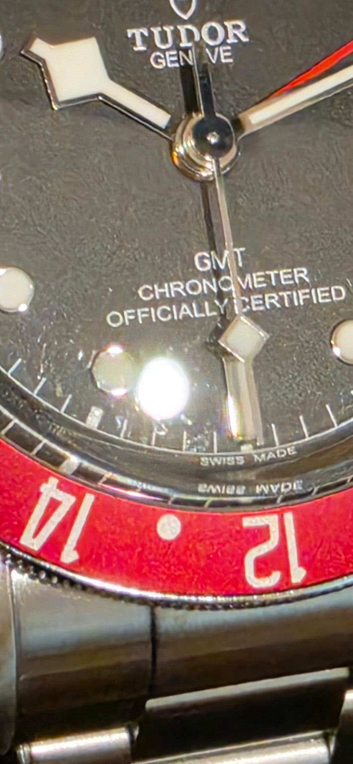Tudor Black Bay GMT 79830RB dial chronometer text and bezel close-up